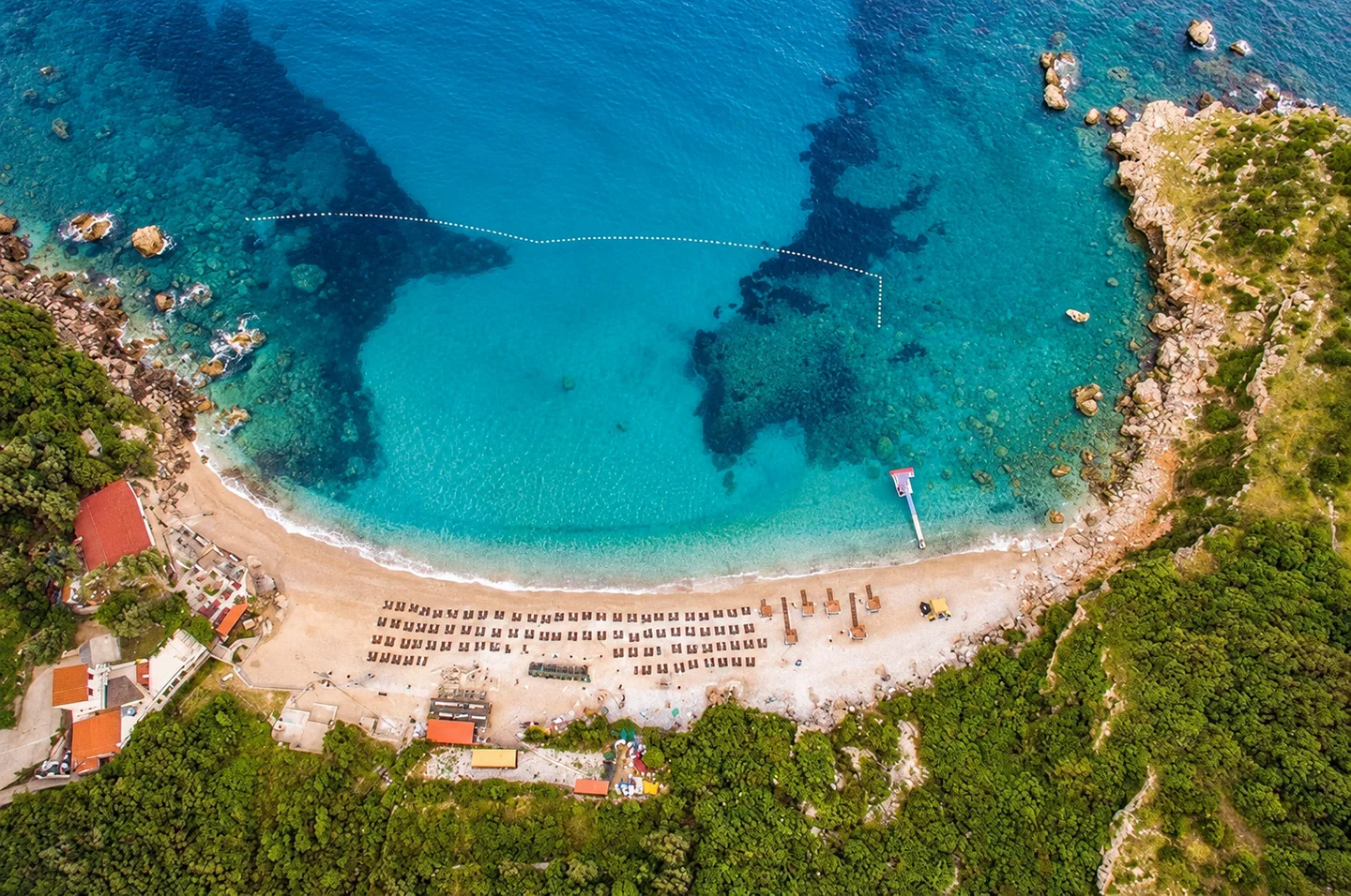 Turquoise water in the cove of Drobni Pijesak