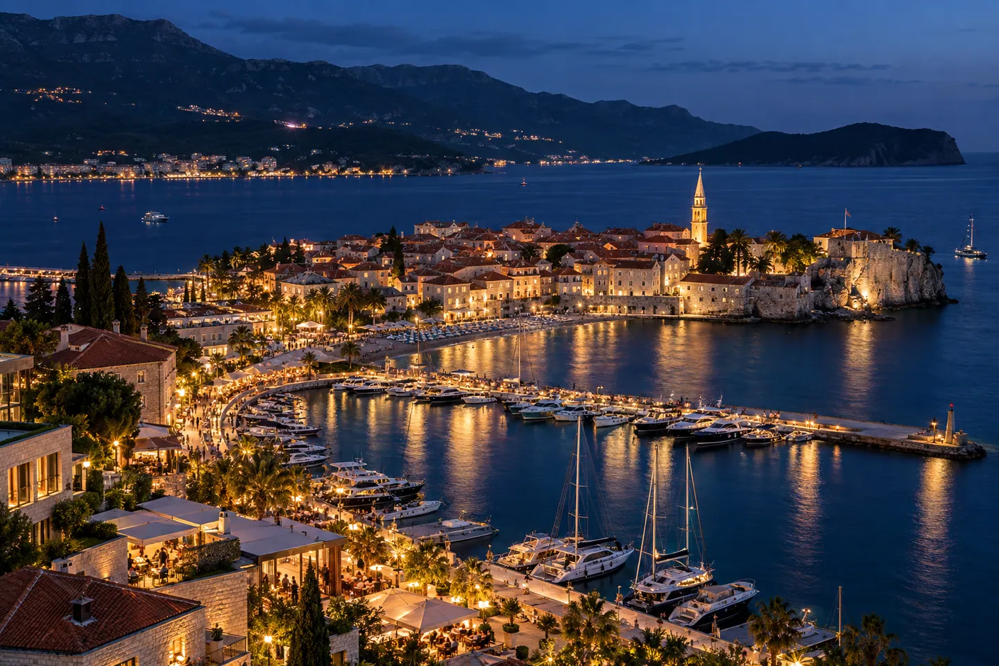 Night-time mood image inspired by Budva, showing a lively coastal promenade